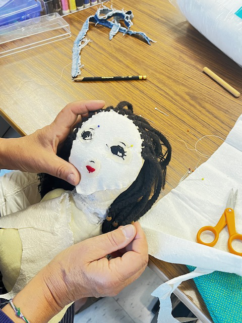 Sewing a doll copy.webp