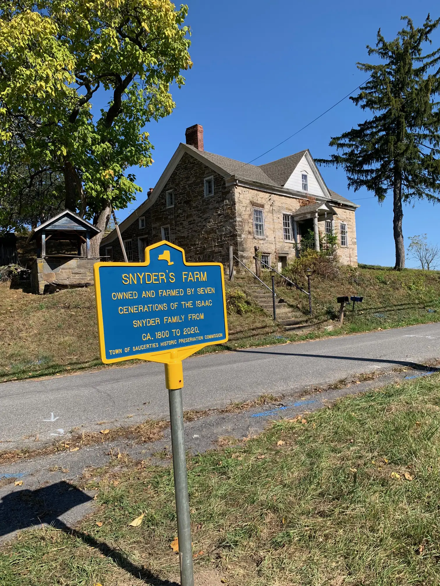 Snyder Farmhouse with its historical marker in the foreground